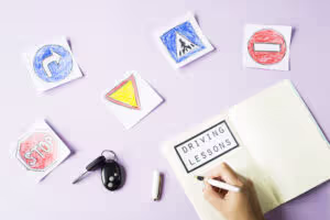 woman writes workbook driving lessons